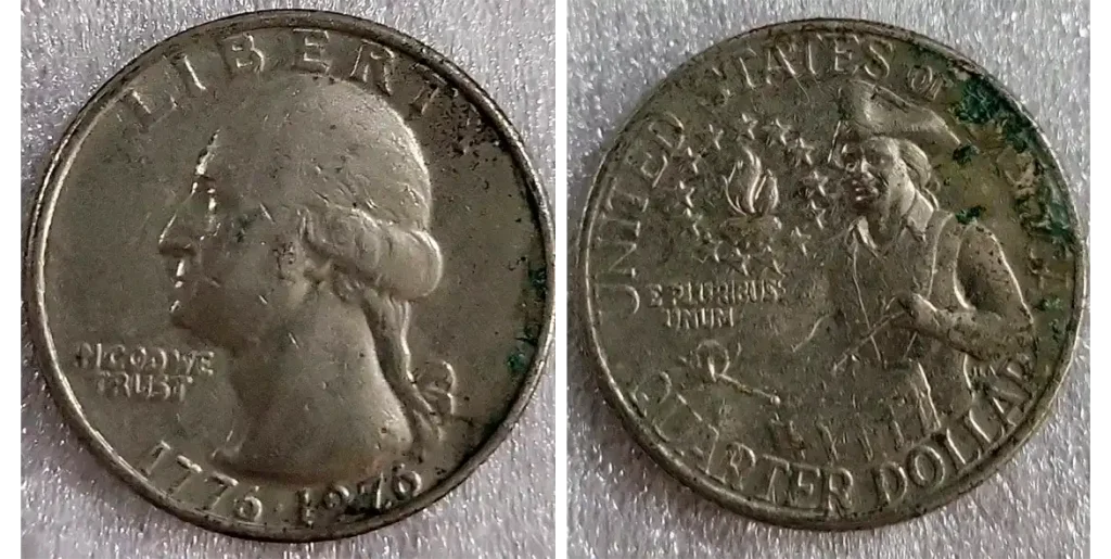 Example of worn 1776-1976 quarter with whipped out details and corrosion which is worth far less than a high-grade specimen.